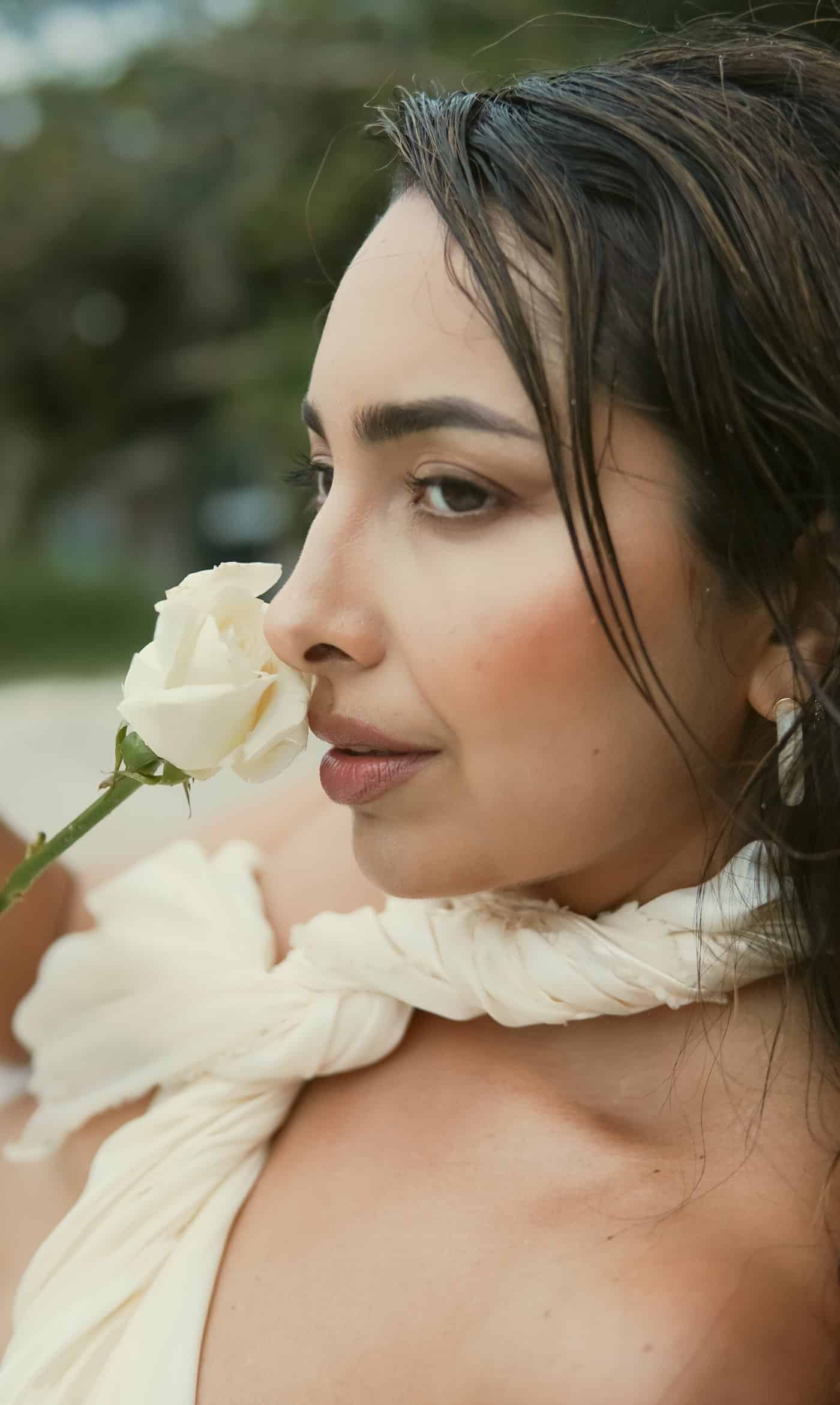 Sahara Rose holding a white rose